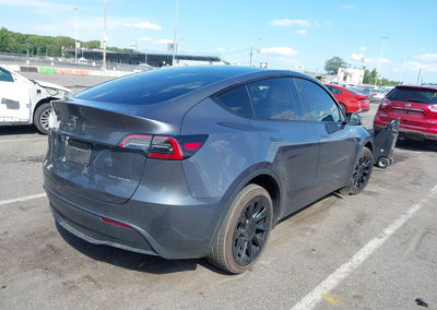 2023 Tesla Model Y Awd/long Range Dual Motor All-wheel Drive, Left Side damage, Iaai lot 45920474, photo 4 of 15