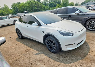 2023 Tesla Model Y, daño Lateral, Copart lote 60638606, foto 4 de 12